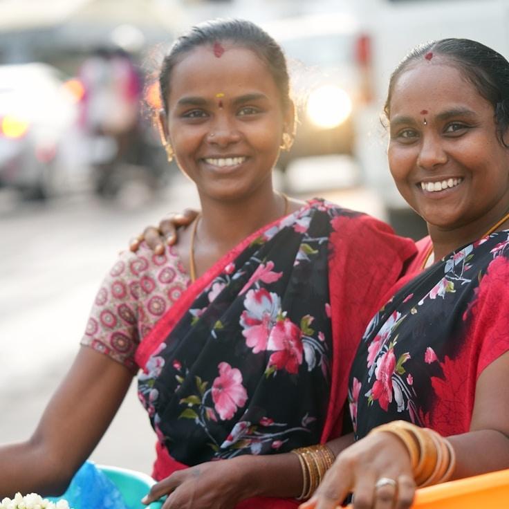 Kaveri Mehta, Lead Design Curator at Cozy Field Village, reviewing corporate floral arrangements